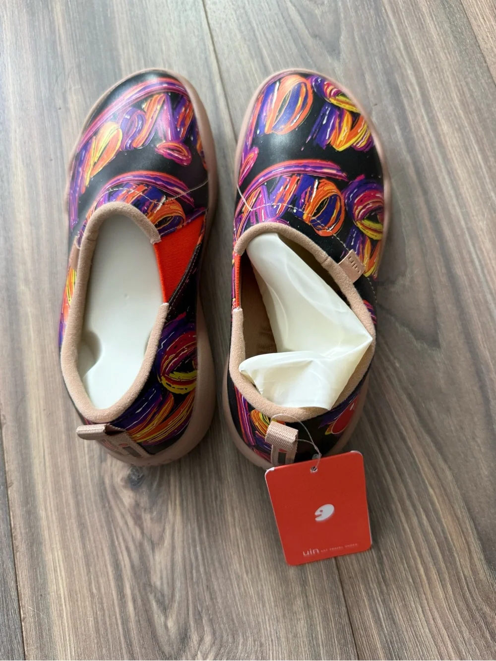 UIN Black Slip-On Shoes with Orange and Purple Swirl